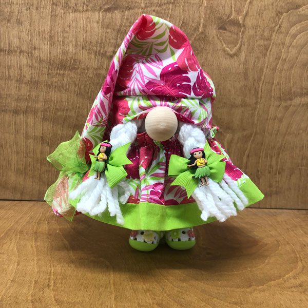 hand crafted gnome ready for the luau in pinks and greens with matching crocs and jibbits.